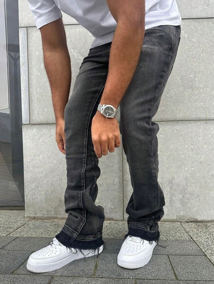 Jean slim pour homme en denim stretch effet usé, style streetwear décontracté adapté à toutes les saisons.