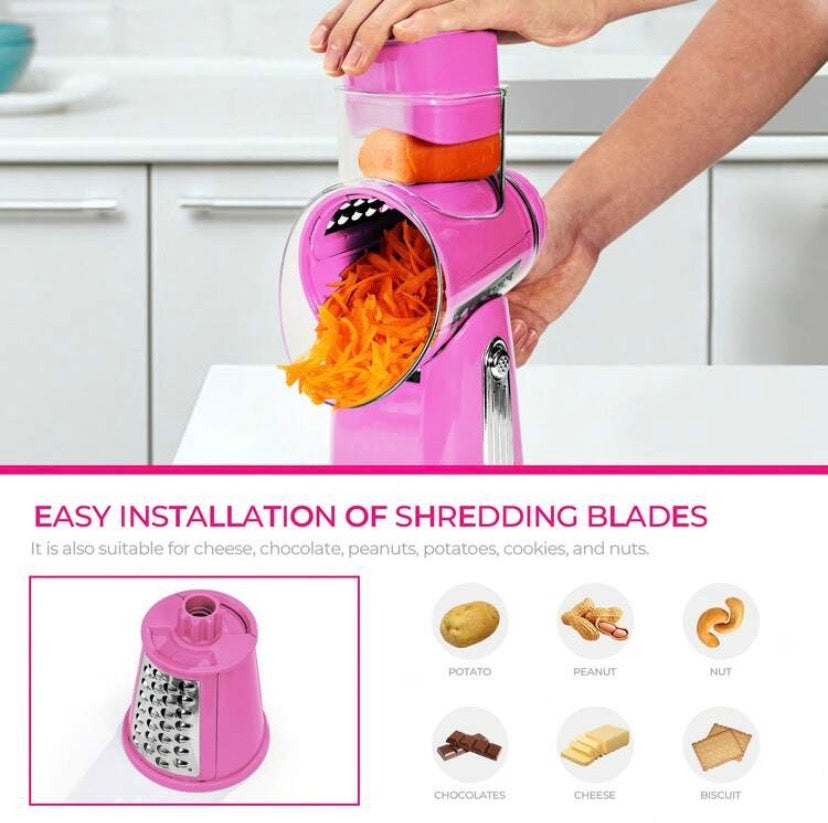 Râpe rotative manuelle avec poignée et lames interchangeables, base ventouse et rangement intégré, idéale pour fromage, légumes et fruits secs.