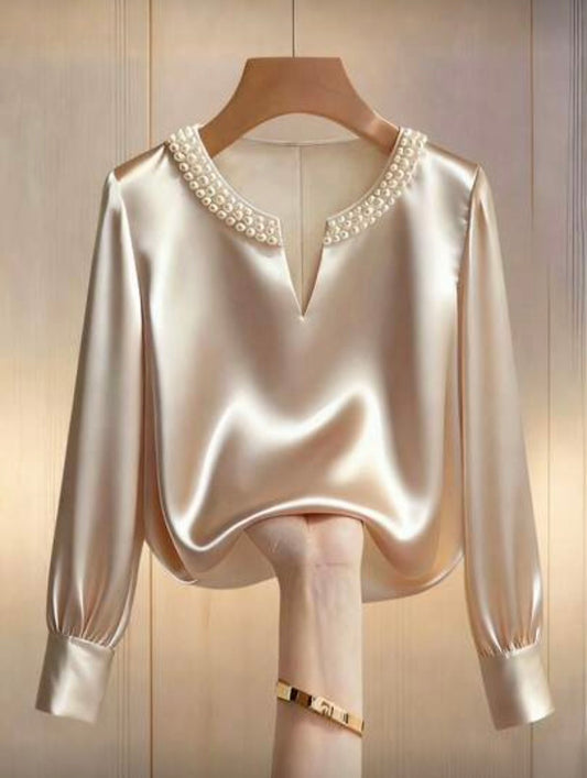 Blouse satinée à manches longues avec perles décoratives, coupe fluide et élégante 👚