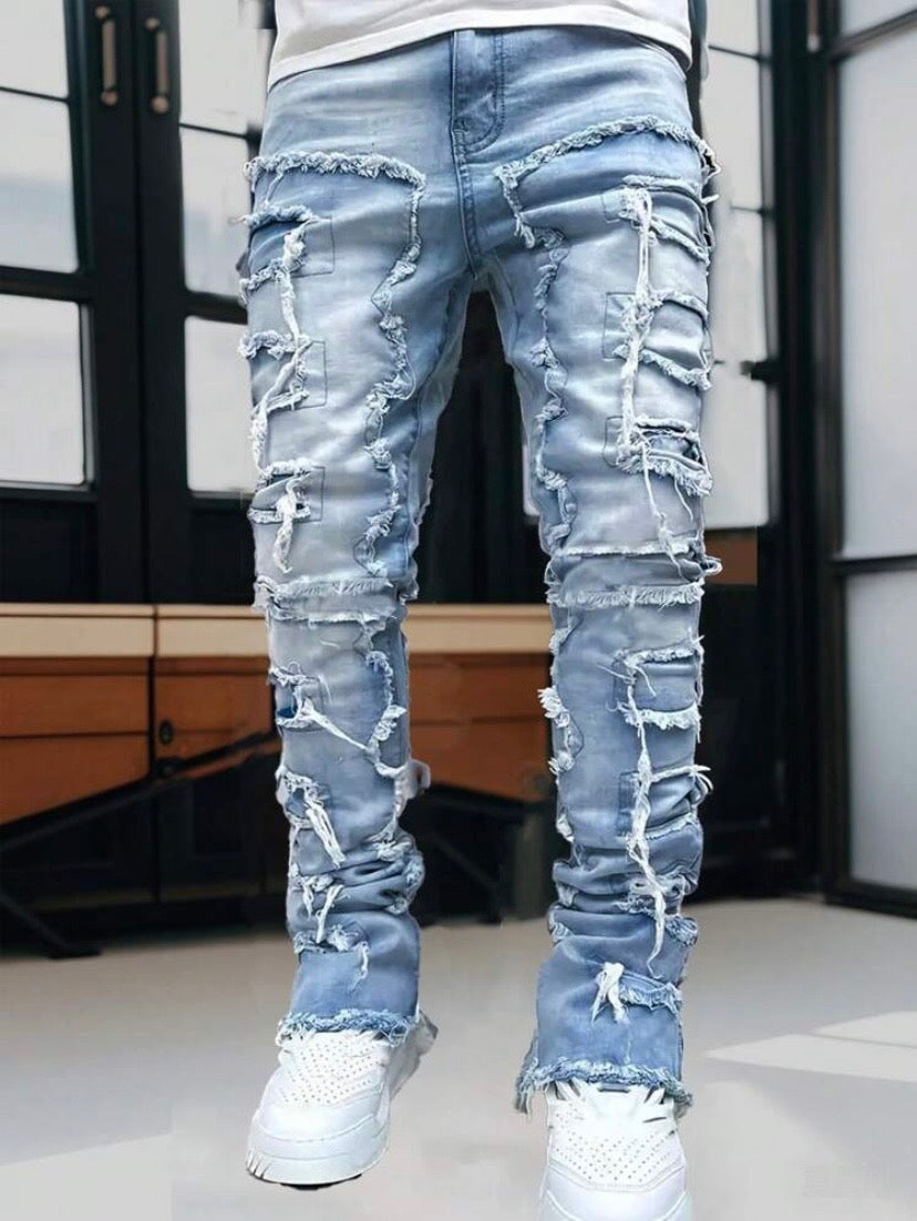 Jean streetwear pour homme avec détails à franges superposées, style créatif et inspiration emo pour un look urbain audacieux.