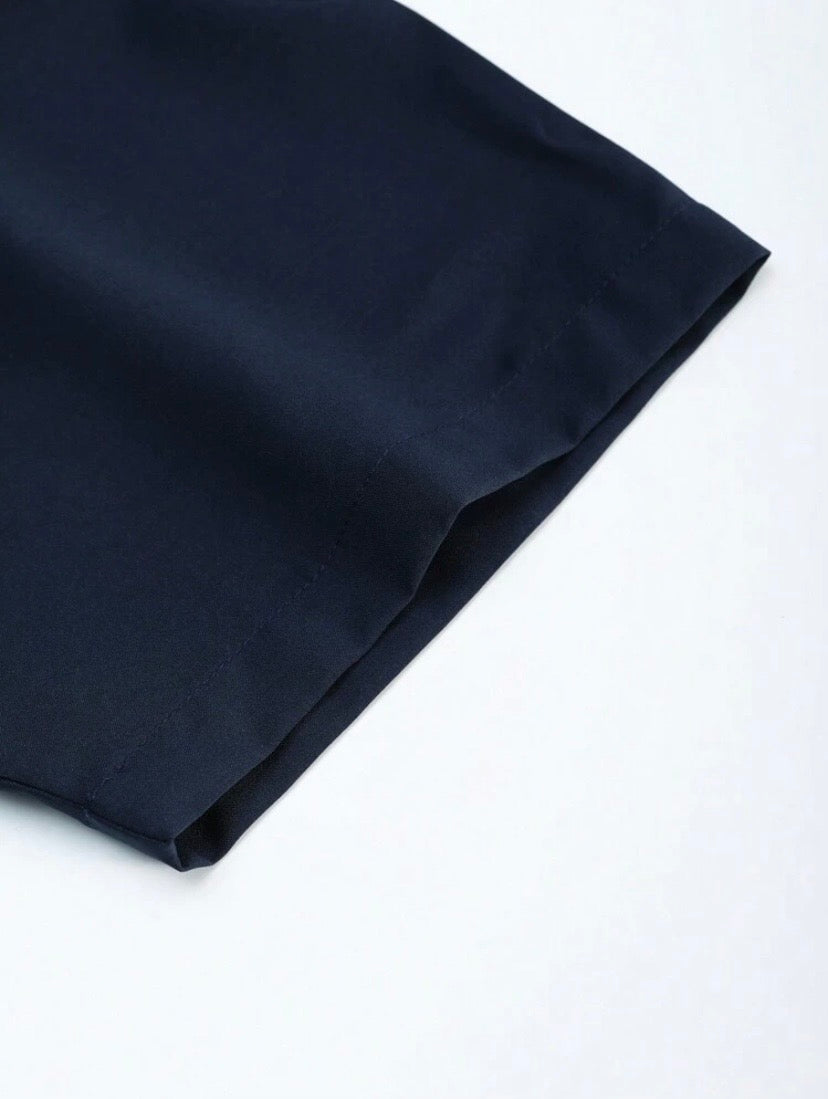Ensemble décontracté pour homme coupe ample en couleur unie avec chemise à col à revers et pantalon confortable.