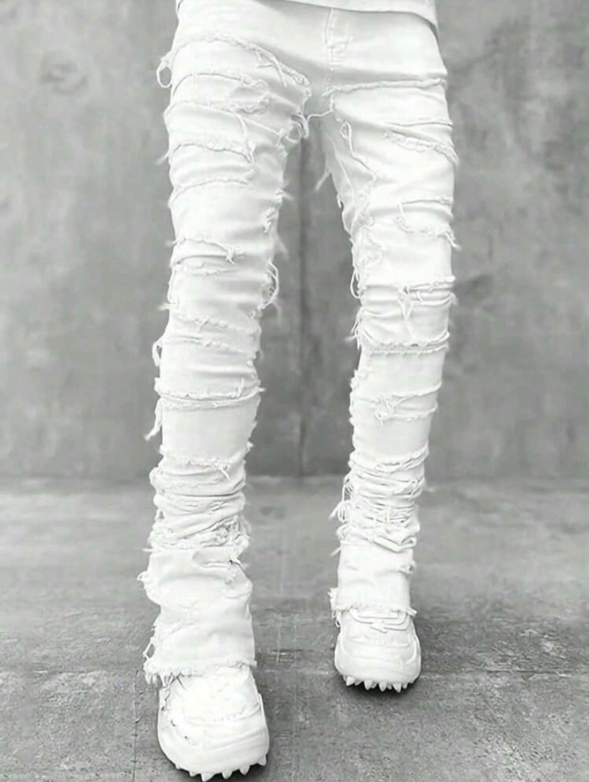 Jean streetwear pour homme avec détails à franges superposées, style créatif et inspiration emo pour un look urbain audacieux.